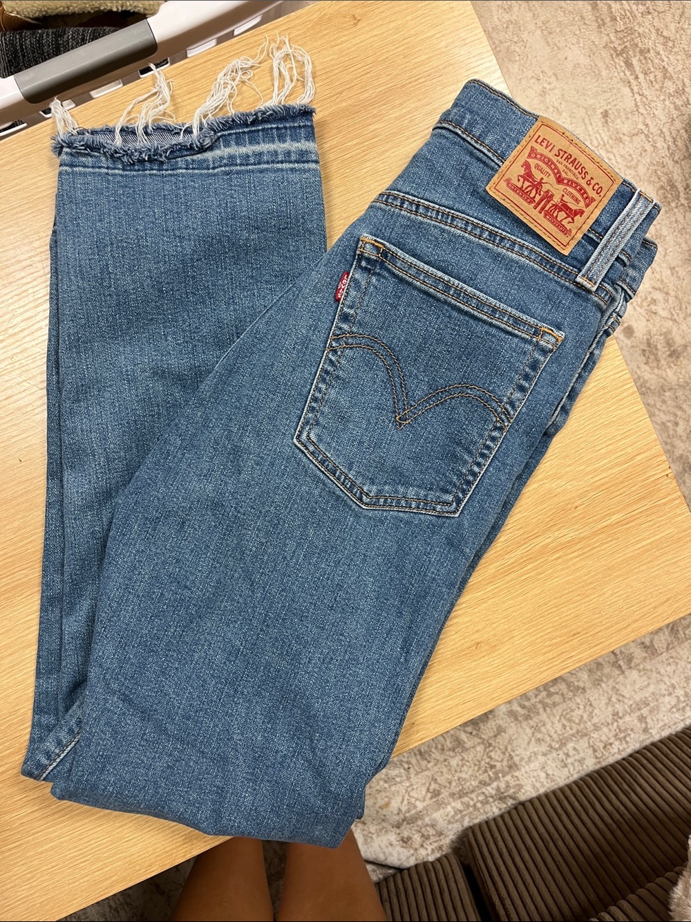 Levi's women’s Medium Blue Slim Straight Jeans with Frayed Hem